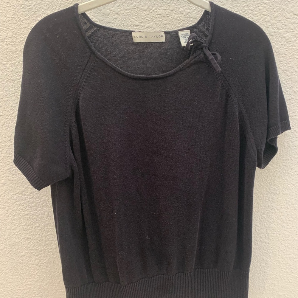 Short sleeve silk blend sweater with neck detail.